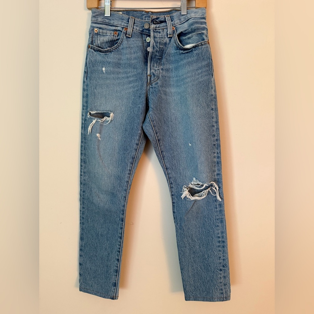 Levi's 501 Blue Jeans with Distressed Details